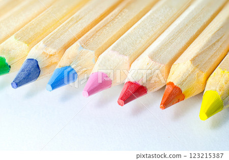 Colored pencils in a row on a white background 123215387