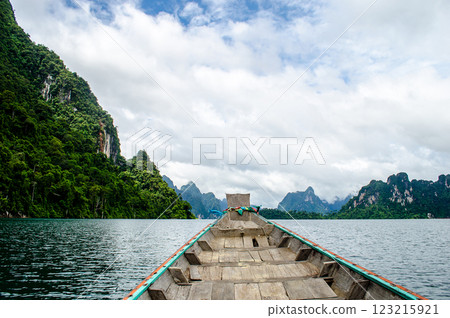 Serene lake view from a wooden boat perspective at Khao Sok national park at Surat Thani, Thailand Serene lake view from a wooden boat perspective at Khao Sok national park at Surat Thani, Thailand 123215921