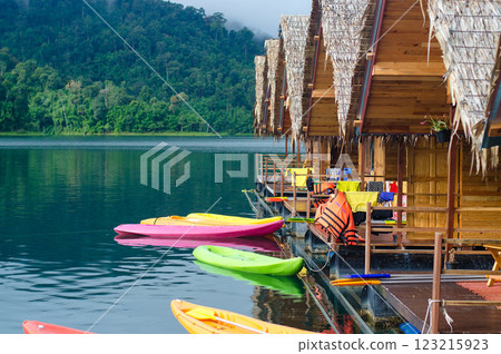 Colorful kayaks by floating huts on a tranquil lake at Khao Sok national park at Surat Thani, Thailand Colorful kayaks by floating huts on a tranquil lake at Khao Sok national park at Surat Thani, Thailand 123215923