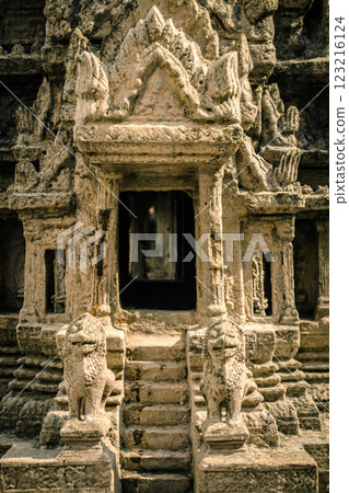 Ancient temple doorway with intricate carvings Ancient temple doorway with intricate carvings 123216124