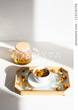Blooming Marigold Tea Ritual. Natural Wellness, Trending Organic Lifestyle. Blooming Marigold Tea Ritual. Natural Wellness, Trending Organic Lifestyle. 123216708