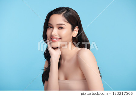 Beautiful Young transgender woman with clean fresh skin on blue background, Face care, Facial treatment, Cosmetology, beauty and spa, transgender women portrait. 123217506