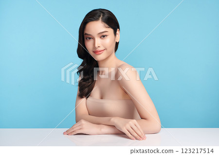 Beautiful Young transgender woman with clean fresh skin on blue background, Face care, Facial treatment, Cosmetology, beauty and spa, transgender women portrait. Beautiful Young transgender woman with clean fresh skin on blue background, Face care, Facial treatment, Cosmetology, beauty and spa, transgender women portrait. 123217514