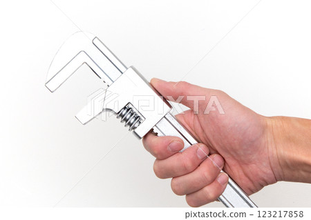 Hand holding a motor wrench Hand holding a motor wrench 123217858