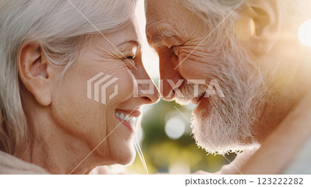 cute pensioners elderly couple in love hugging 123222282