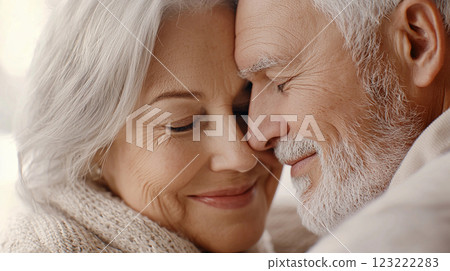 cute pensioners elderly couple in love hugging 123222283