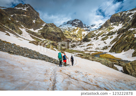 Group of hikers on the snowy slope in the Alps Group of hikers on the snowy slope in the Alps 123222878