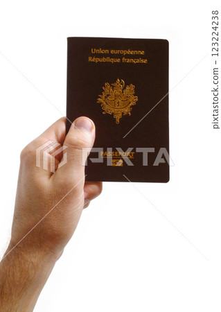 Hand holding a French passport 123224238