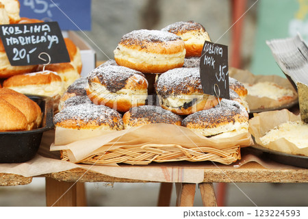 Bakery stall with poppy seed doughnuts on display Bakery stall with poppy seed doughnuts on display 123224593