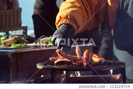 Grilling Sausages on Outdoor Barbecue During Autumn Street Festival Grilling Sausages on Outdoor Barbecue During Autumn Street Festival 123224724