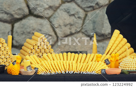 Stand with a wide range of beeswax candles at the Christmas farmers market  123224992