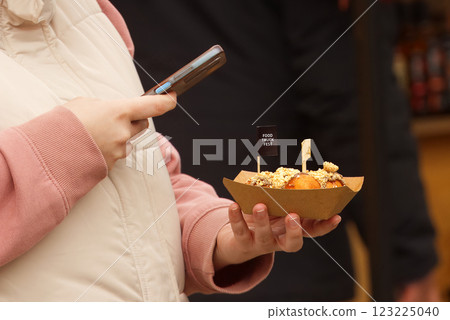 Young woman taking picture, selfie of her dessert. Young woman taking picture, selfie of her dessert. 123225040