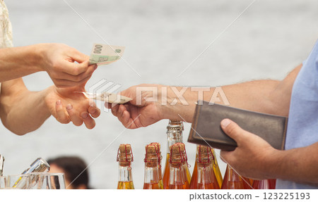 Payment for goods at the farmers market. Payment for goods at the farmers market. 123225193