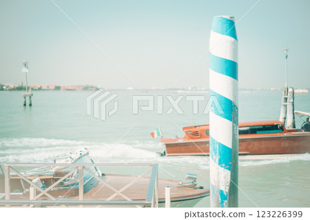 Venetian canals and boats (Venice, Italy) 123226399