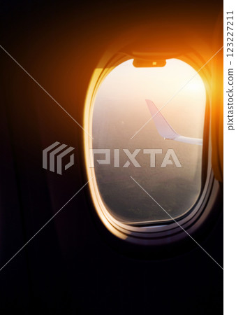 Majestic view through window of wing of plane 123227211