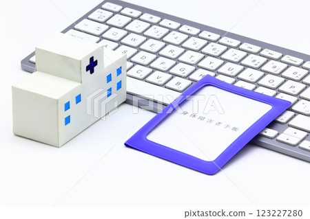 Image of a computer and a disability certificate 123227280