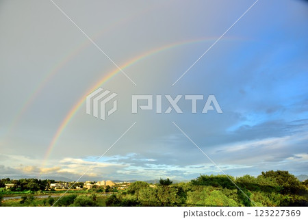 Tachikawa City: A beautiful rainbow in the sky after the rain 123227369