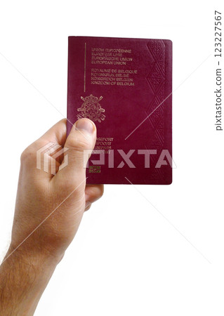 Man holding a Belgian passport against a white background Man holding a Belgian passport against a white background 123227567
