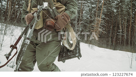 Usa Army Soldiers Of World War Ii. Re-enactors Dressed As American Infantry Soldier Going Through Forest Road With Mortar. Two Usa Soldiers Marching By Country Road. 123227674