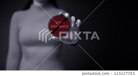 Protest and Expression Concept. Young Women Raised a Word of Stop Violence.  Front View and Dark Dramatic tone 123227783