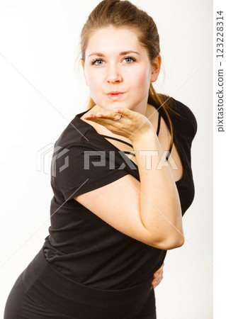 Portrait of happy attractive woman sending air kiss Portrait of happy attractive woman sending air kiss 123228314
