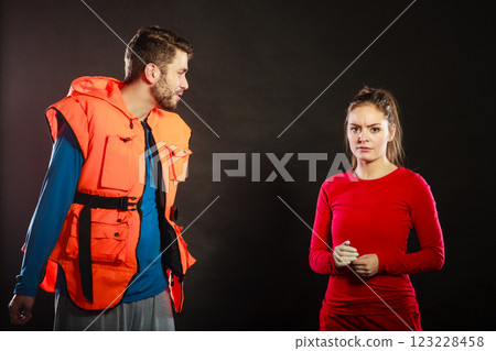 Angry man lifeguard shouting at woman lifesaver. Angry man lifeguard shouting at woman lifesaver. 123228458