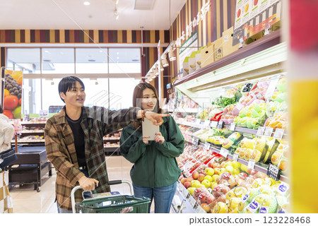 Young people shopping at a supermarket: fruits 123228468