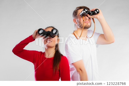 Couple looking through binoculars 123228766