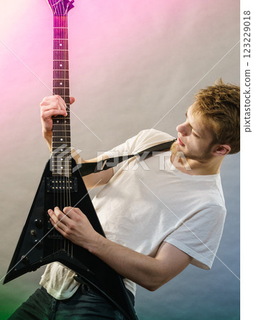 Man playing on electric guitar Man playing on electric guitar 123229018