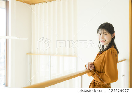 Young woman going down the stairs 123229077