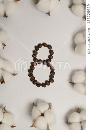 International Women's Day 8 March. Number eight made of coffee beans on white background. Cotton inflorescence plant. Greeting card International Women's Day 8 March. Number eight made of coffee beans on white background. Cotton inflorescence plant. Greeting card 123229669