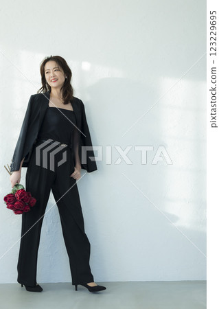 Middle-aged woman in a black suit 123229695