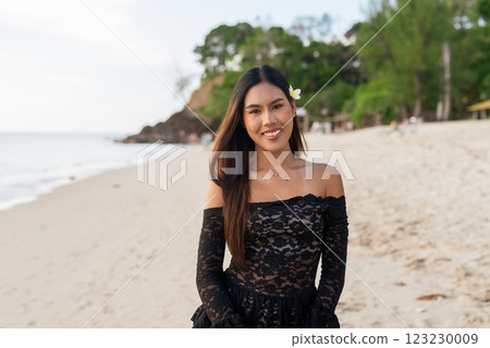 Beautiful young Asian woman during summer beach holiday Beautiful young Asian woman during summer beach holiday 123230009