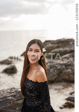 Beautiful young Asian woman during summer beach holiday 123230038