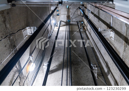 Elevator Shaft featuring Cables and Bright Lights for Enhanced Functionality and Aesthetics 123230299