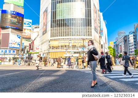 Morning commute business woman Shibuya scramble crossing 123230314