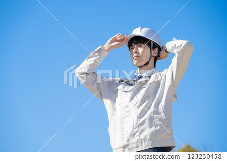 A man wearing work clothes 123230458