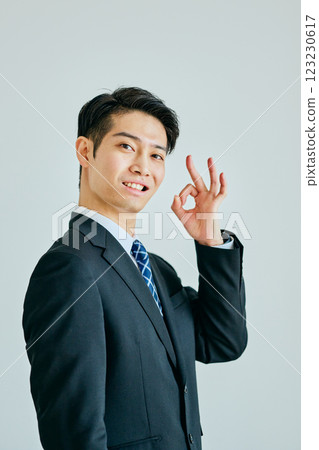 A young man making an OK pose A young man making an OK pose 123230617