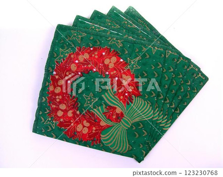 Green holiday napkins with a red Christmas wreath 123230768