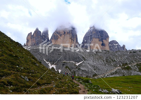 A group of unknown hikers on the final section of the circular route around Tre Cime di Lavaredo in South Tyrol, Italy 123231207