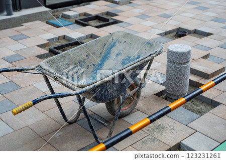 Construction site exterior work: Tiling the entrance 123231261