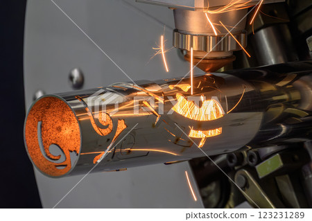 Close up scene the fiber laser cutting machine cut the stainless steel tube and sparkling light. Close up scene the fiber laser cutting machine cut the stainless steel tube and sparkling light. 123231289