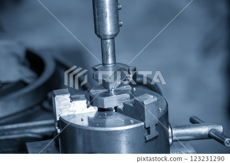 The hole chamfering process on NC milling machine by chamfer tool in the light blue scene. 123231290