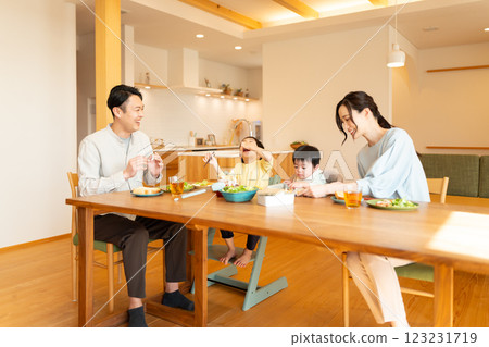 Family of four having breakfast 123231719