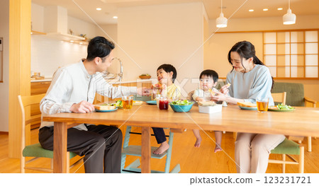 Family of four having breakfast 123231721