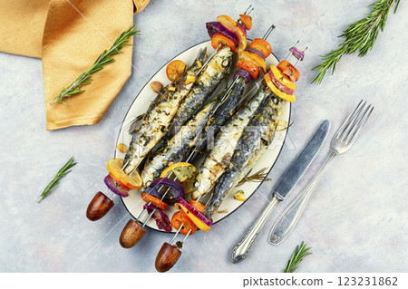 Baked sardines skewers. 123231862
