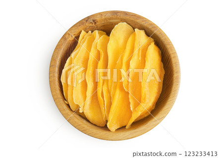 dried mango in wooden bowl isolated on white background. Top view. Flat lay dried mango in wooden bowl isolated on white background. Top view. Flat lay 123233413