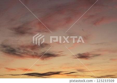 Beautiful sunset with vibrant clouds creating a serene and colorful evening sky 123233509