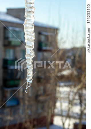 Close-Up of Hanging Icicle on a Sunny Winter Day 123233590