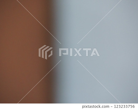 blurred two-tone background with contrasting uneven parts of gray and brown shades with empty copy space, defocused graphic minimalist backdrop 123233756